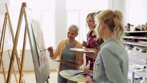 Women Painting Together in Art Studio Class