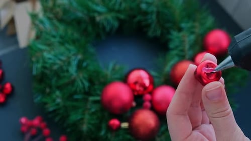 Creating Christmas Wreath with Red Ornaments and Jingle Bells