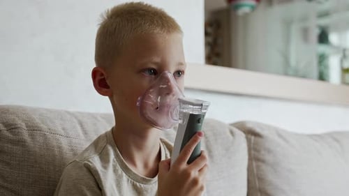 Child Using Nebulizer Mask at Home