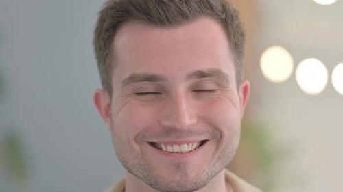 Close Up of Smiling Young Businessman Face
