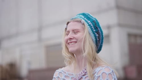 Smiling Woman in Crocheted Cap