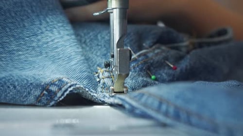 Denim is Being Stitched By a Sewing Machine