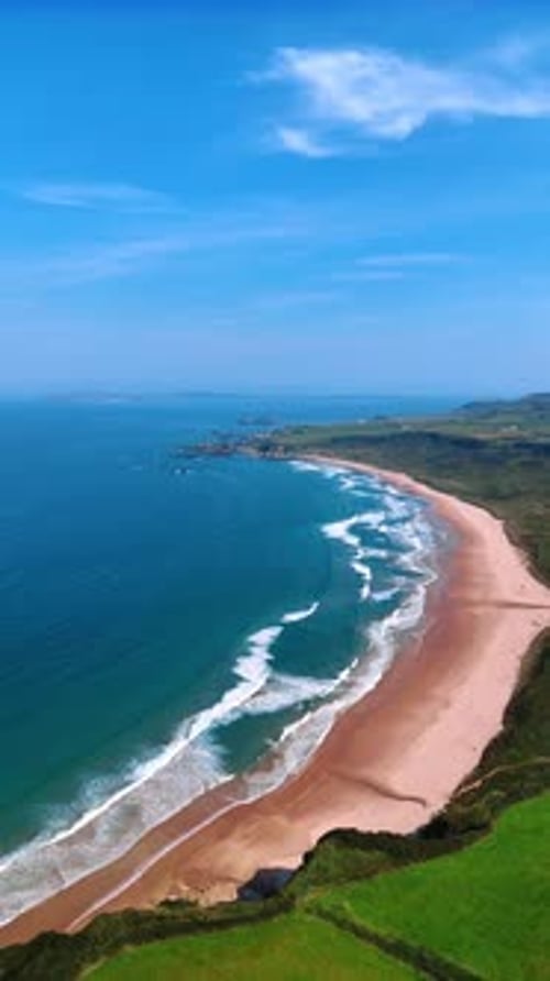 Narrow sandy beach at the coast of the Atlantic Ocean.