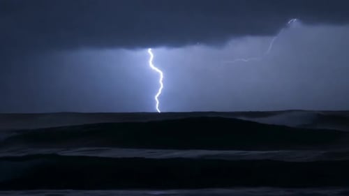 Lightning Strikes Illuminate The Stormy Sea At Night