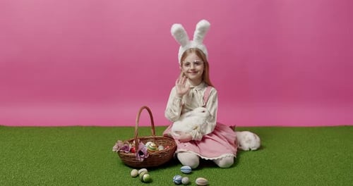 Girl with Bunny Ears Holding White Rabbit