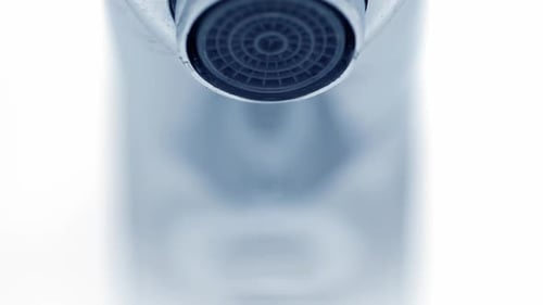 Water Drops Dripping from Chrome Faucet Close Up