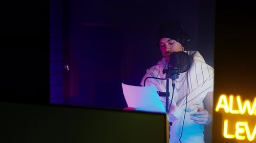 Male Recording Artist Singing in a Recording Studio