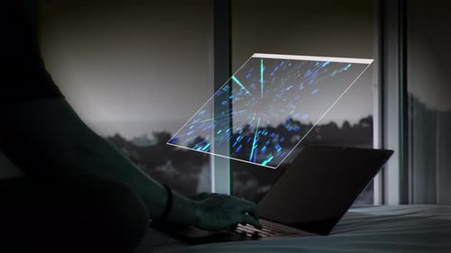 Laptop with Floating Screen in Bedroom at Night