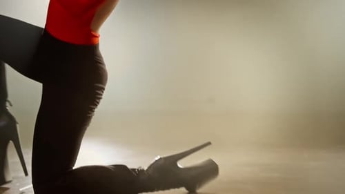 Sensual Woman Dancing in Dark Studio with Lighting Artist Performance