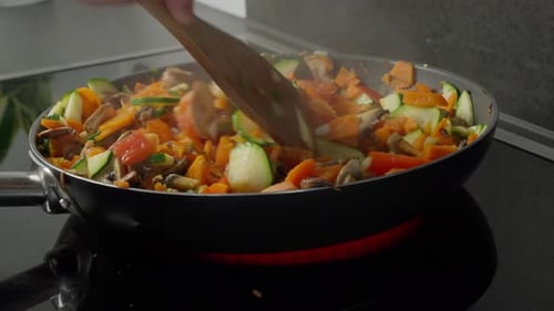 Stir-fried Vegetables in a Pan on a Stove