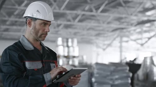 Engineer Plan of Manufacture Work. Caucasian People in Hard Hat or Safety