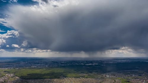 City and Landscape Under a Dramatic Cloudy Sky
