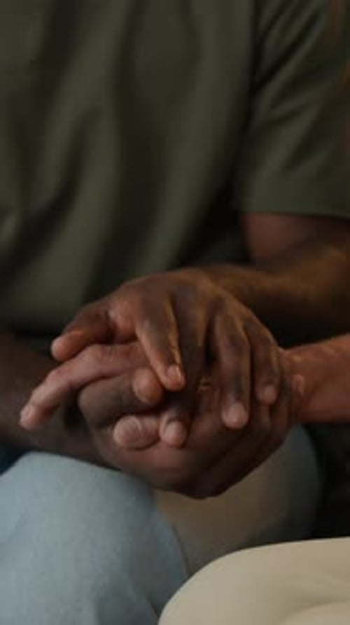 Man Holding Hands with Senior Vertical