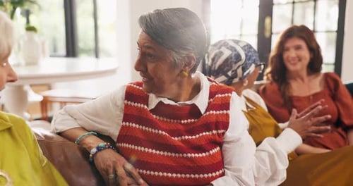 Group of Women Talking on Sofa in Living Room