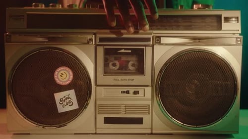 Putting Cassette in Ghetto Blaster and Turning on Music