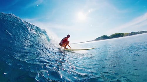 Slim Sexy Woman Surfer in Red Swim Suit Surfs the Blue Ocean Wave on Yellow Longboard