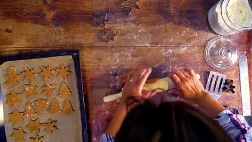 Rolling Dough and Making Christmas Cookies from Above