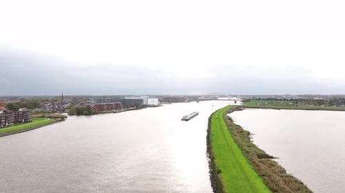 The normally busy Noord River being travelled by an isolated cargo vessel
