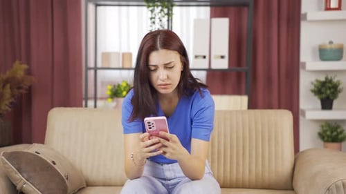 Woman Upset by Content on Mobile Phone