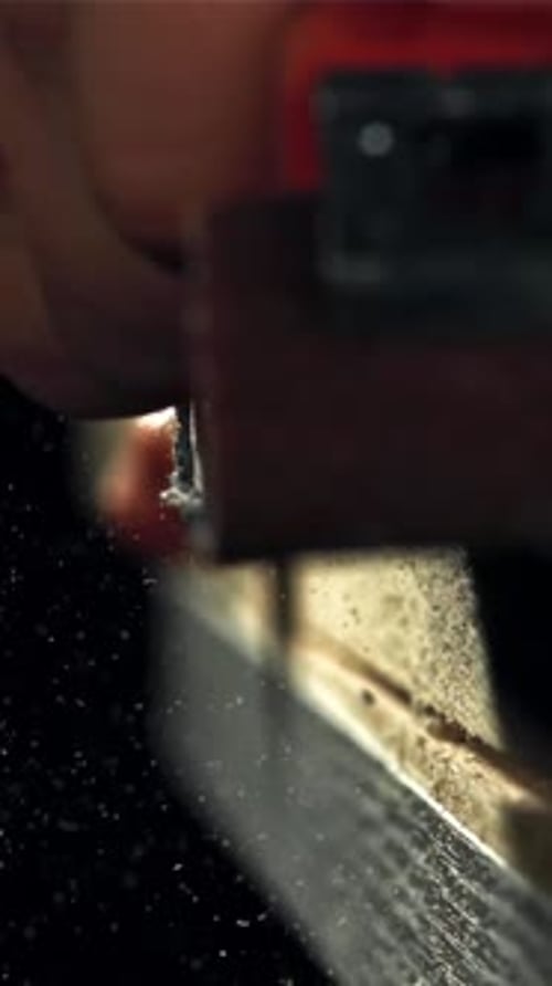 A Carpenter Sands a Wooden Plank Filmed on a Highspeed Camera at 1000 Fps