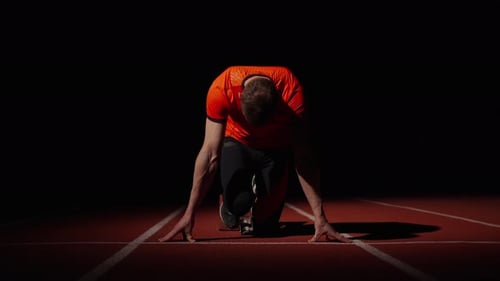Start Of Professional Runner On Sprint Lane In Stadium Intensive Workout Of Sportsman In Night