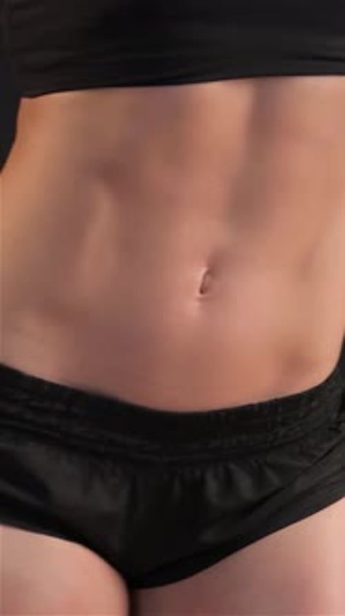 Athletic Person with Visible Abdominal Muscles Close Up