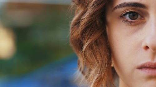 Close-up of Young Woman's Face, Intense Gaze