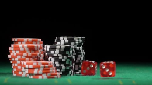 Rolling Dice and Stacks of Casino Chips