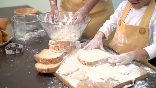 Professional pastry chef asian mom and son making bakery bread cake prepare delicious sweet food