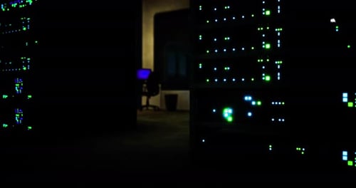Data Center Illuminated with Vibrant Lights and Computer Equipment at Night