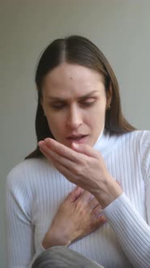 Sick Young Woman Coughing and Feeling Unwell