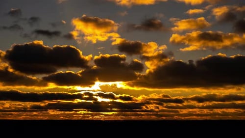 Dramatic Golden Sunset Through Moving Clouds Timelapse