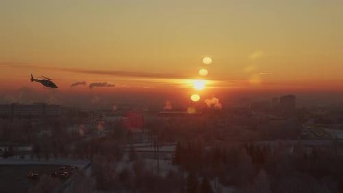 Time Lapse of Industrial City with Lot of Smoking Chimneys at Sunset Through Glass 4 Suns are