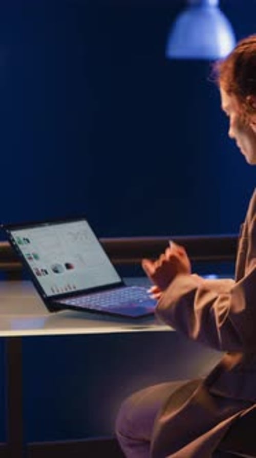 Vertical Video Executive Manager Analyzing Economy Graphs on Screen