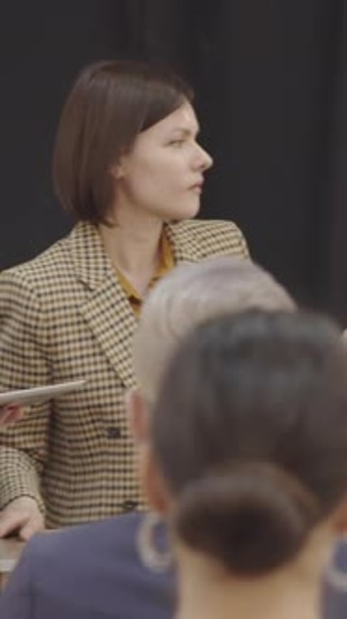 Woman Giving Presentation at a Corporate Conference