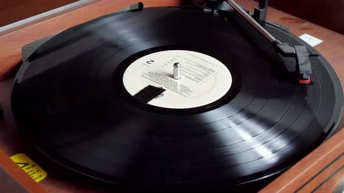 Black Vinyl Record Spins on Turntable