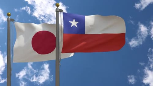 Flags of Japan and Chile Waving Under Blue Sky