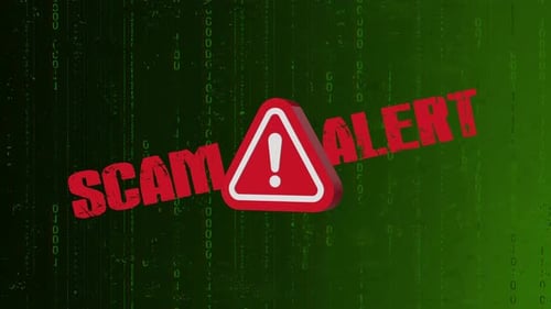 A green background warning sign with the word scam alert
