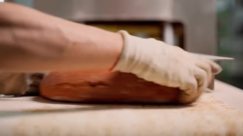 Bread Sliced in Manufacturing Workplace
