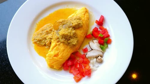Delicious Omelet with Chopped Vegetables on White Plate