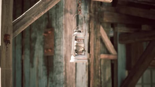 Vintage Kerosene Lantern Gently Swinging on Wooden Beam
