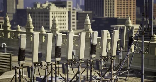 Modern Communication Antennas on City Rooftop with Skyline