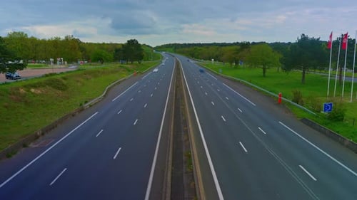 Time Lapse View of Cars Driving Along Roadway in Rush Hour in France Toll Road Near Paris