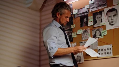 Close Up Detective Office Middle Aged Investigator in Shirt and Tie Standing Near Clue Board for