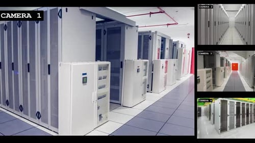 Four security camera views of business computer server room interiors, slow motion