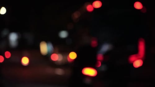 Defocused View of night city traffic