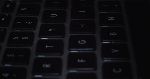 Black Keyboard Of Laptop Computer. - close up, tilt down