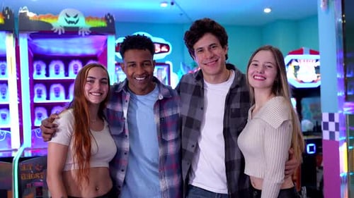 Happy Friends Posing Together in an Arcade