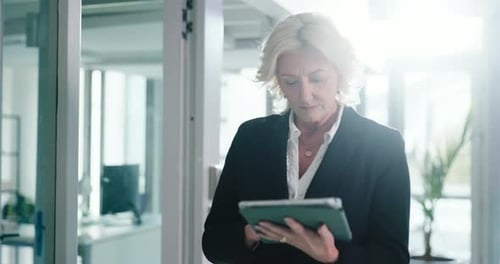 Office, walking and business woman on tablet for company revenue, finance report or profit growth