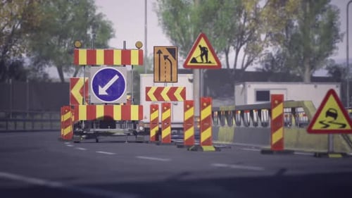 Signs and Barriers Guiding Traffic Away From Maintenance Area